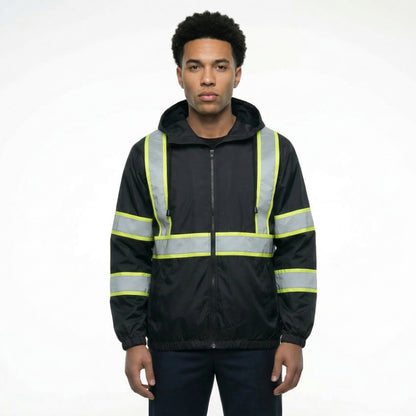 Person wearing a black safety jacket with reflective yellow stripes on a white background