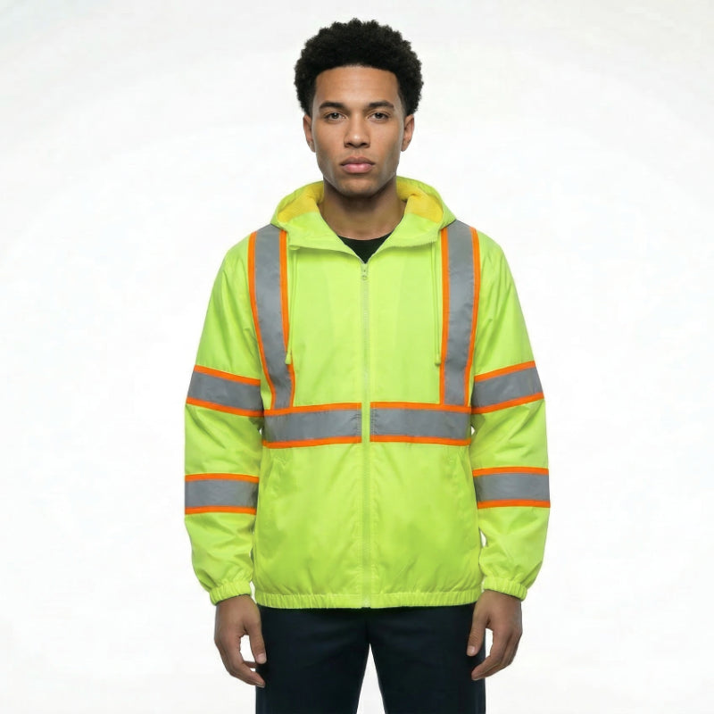 Person wearing a bright yellow safety jacket with reflective stripes on a white background