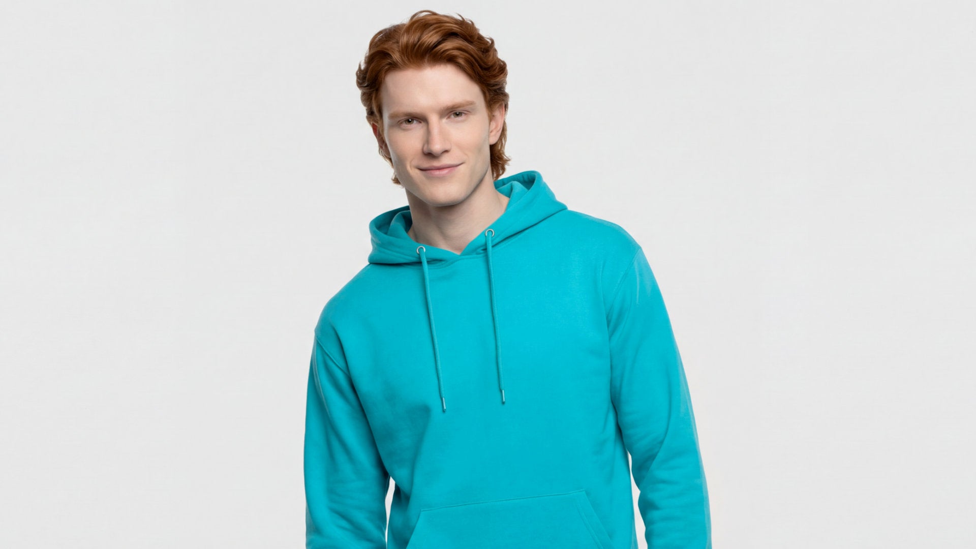 Person wearing a turquoise hoodie on a light gray background