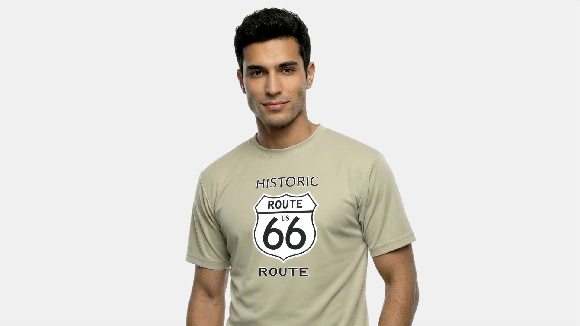 Man wearing a beige t-shirt with 'Historic Route 66' design on a white background